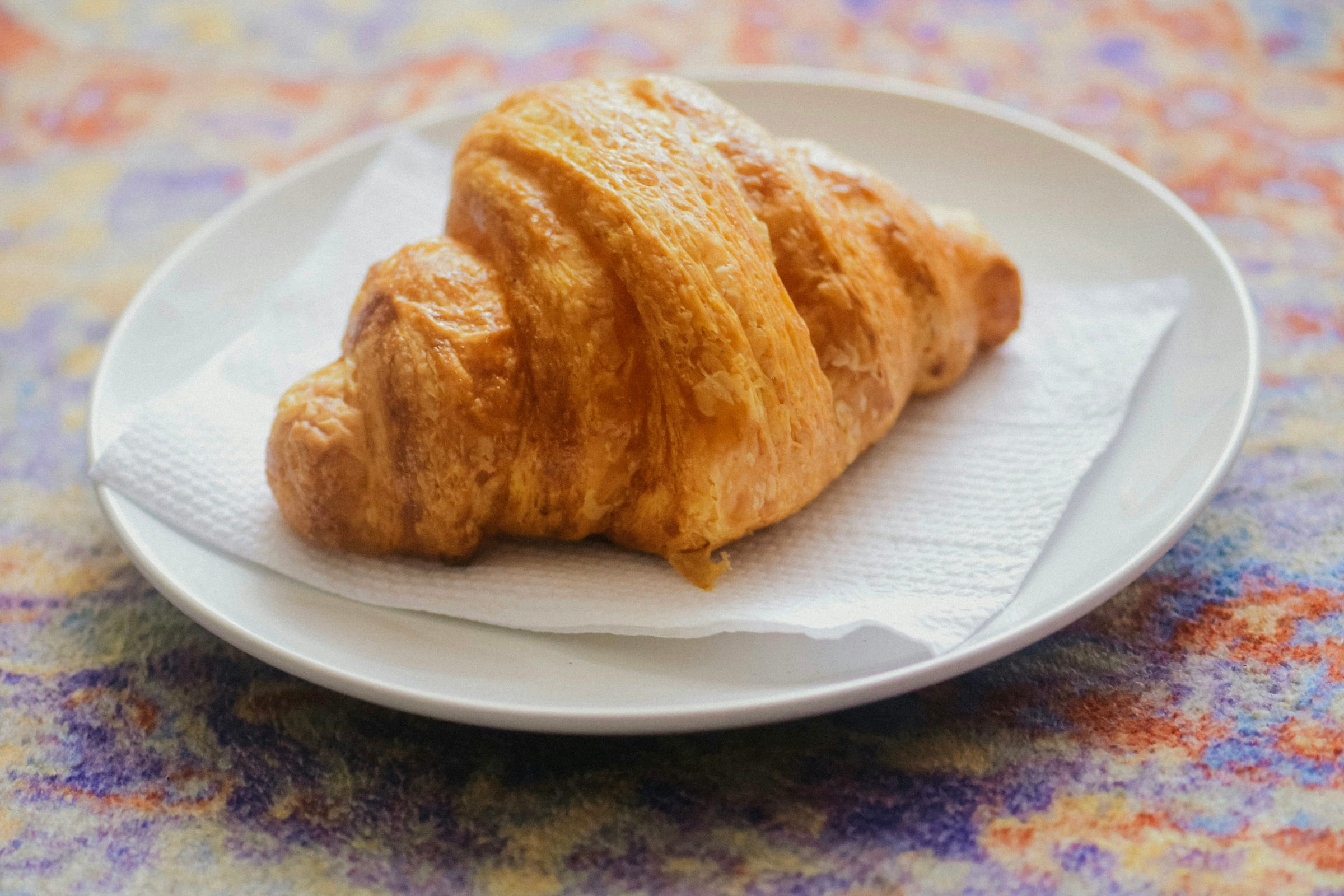 Golden butter croissant on a plate