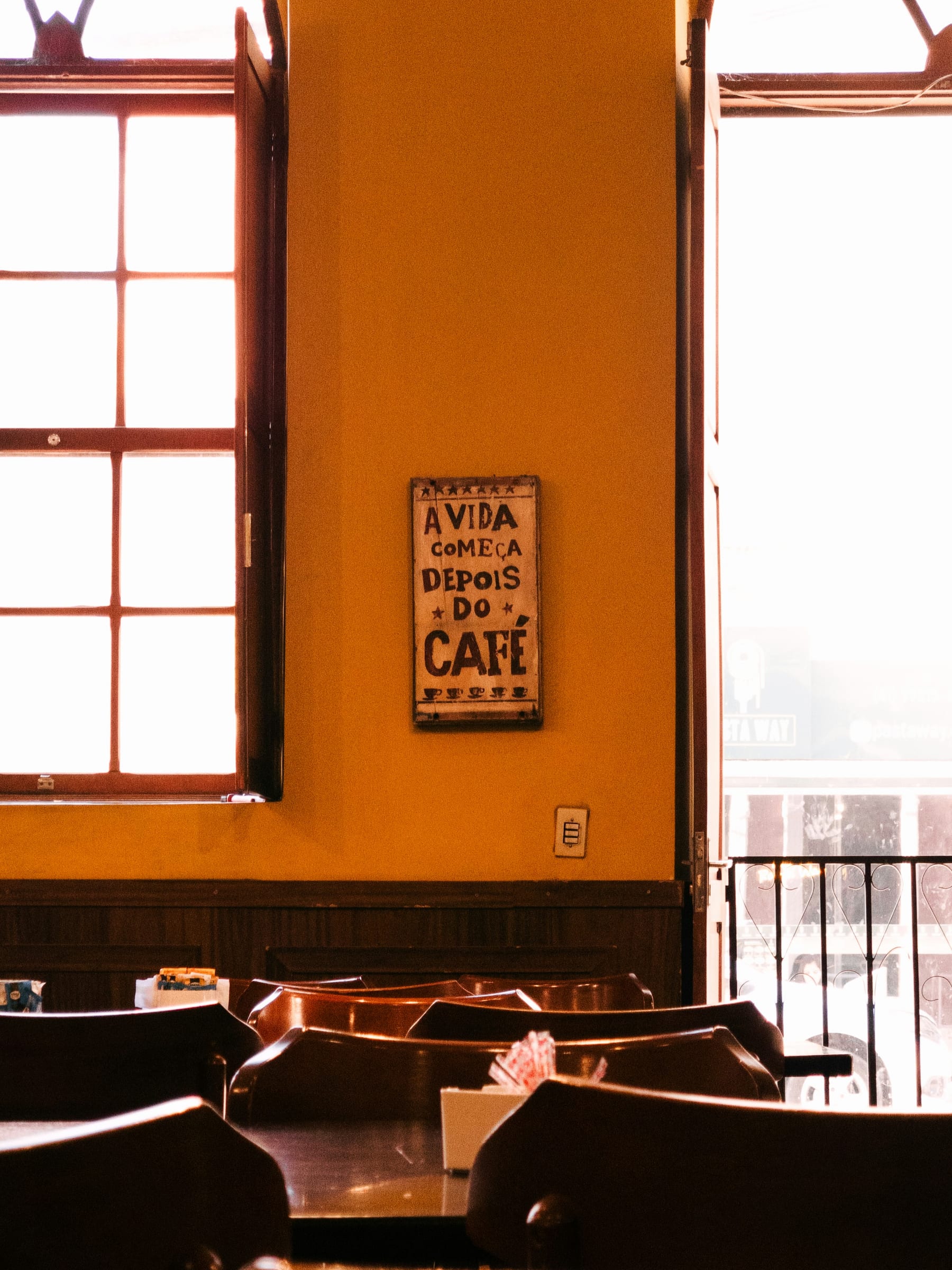 Empty café tables in soft window light